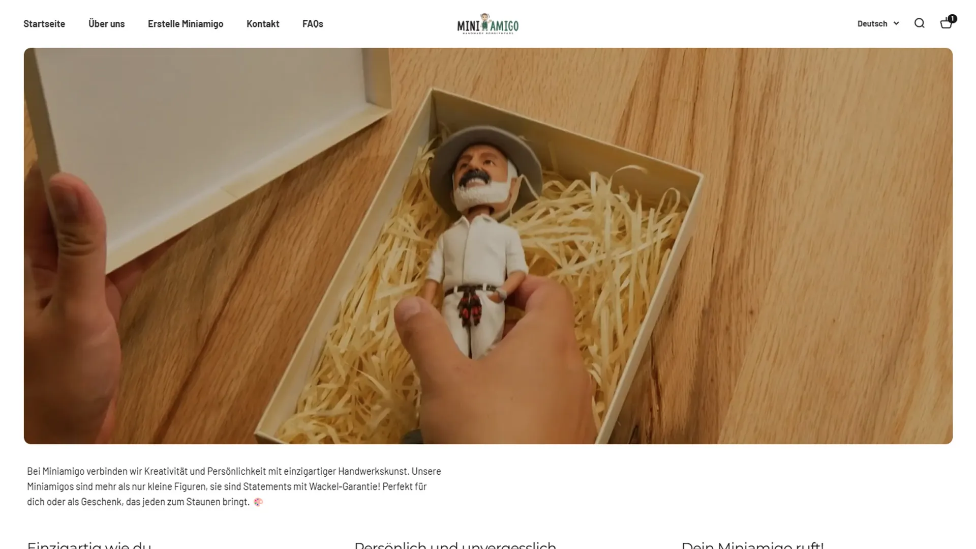 Startseite von Miniamigo mit einer Figur im Geschenkkarton
